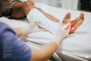 A man sitting with his foot in pain